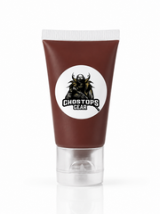 A squeeze tube of Ghosts Gear product in a dark reddish-brown color, featuring a white circular logo with a black horned soldier graphic. The tube has a clear plastic cap and is shown on a clean white background with a soft reflection.