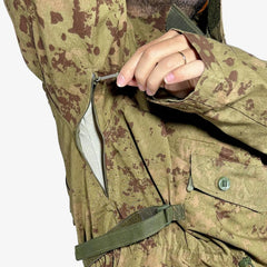 KMCS Field Smock, featuring a camouflage outer layer designed for outdoor concealment and protection.
