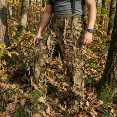 KMCS Ghillie Suit Oakland, featuring green and brown camouflage elements with a leaf-style texture for outdoor concealment.