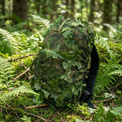 KMCS Bag Cover, featuring a camouflage cover designed to conceal and protect bags in outdoor environments.