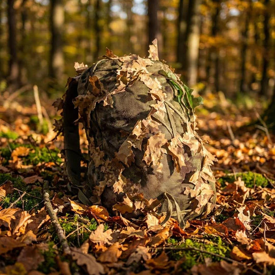 KMCS Bag Cover, featuring a camouflage cover designed to conceal and protect bags in outdoor environments.