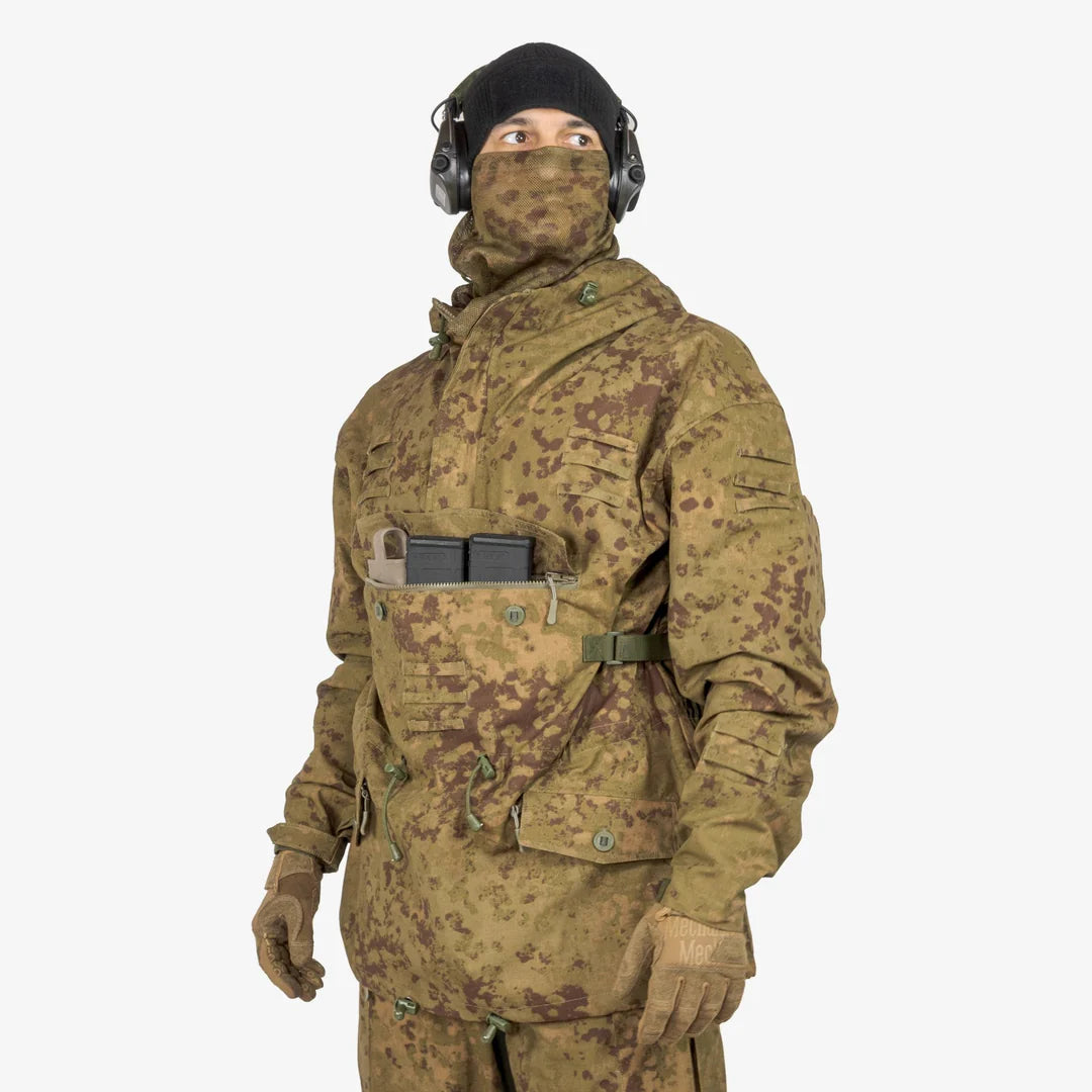 KMCS Field Smock, featuring a camouflage outer layer designed for outdoor concealment and protection.