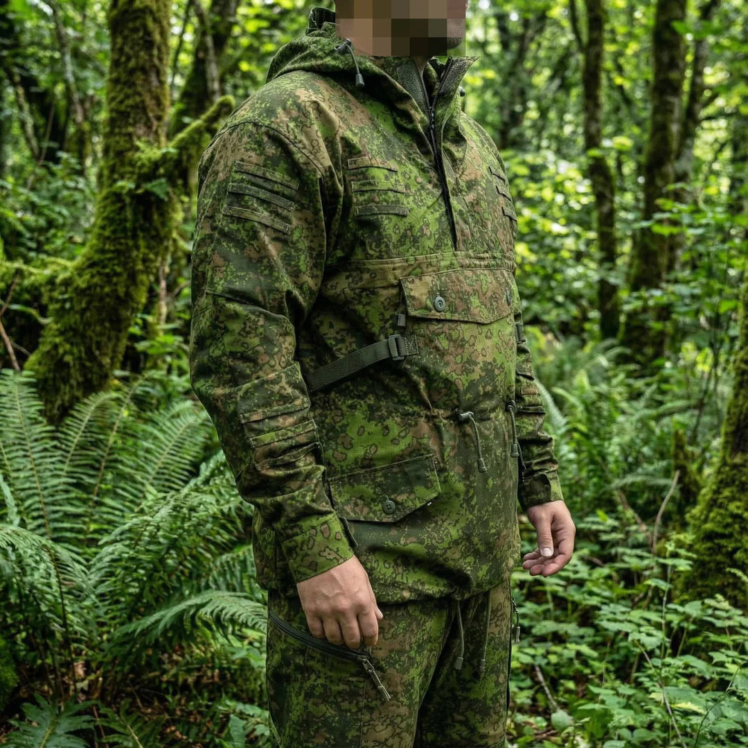 KMCS Field Smock, featuring a camouflage outer layer designed for outdoor concealment and protection.