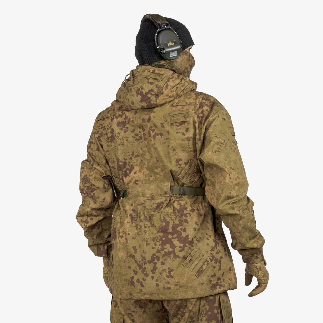 KMCS Field Smock, featuring a camouflage outer layer designed for outdoor concealment and protection.