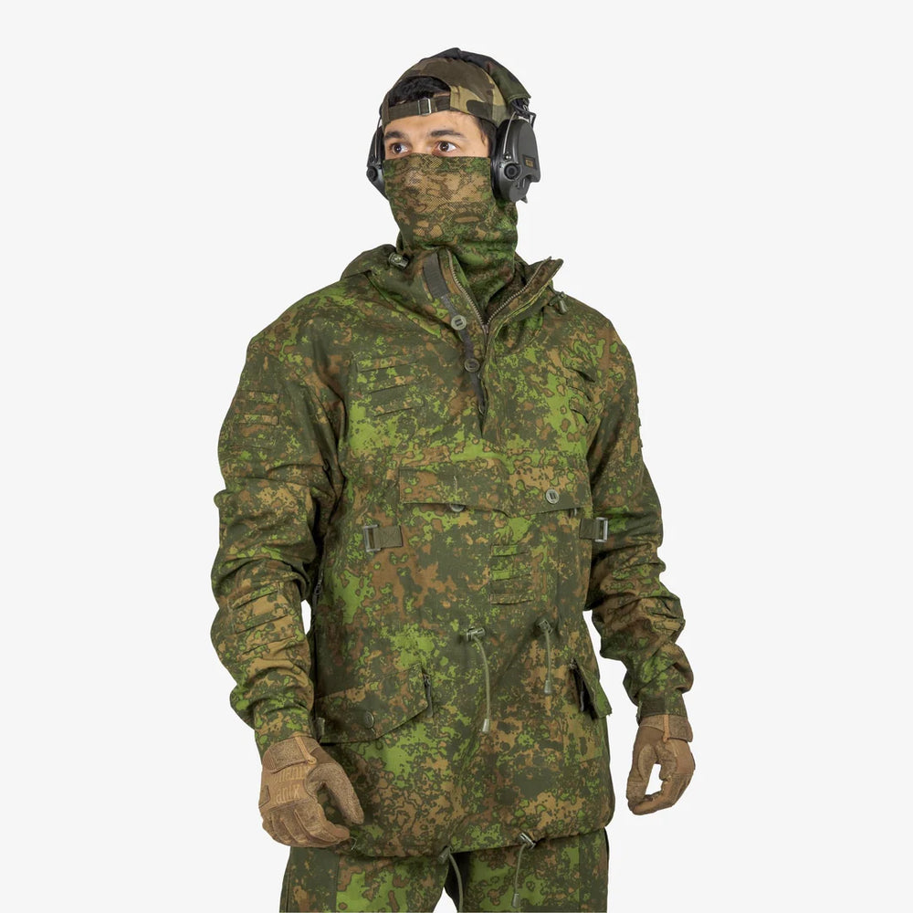 KMCS Field Smock, featuring a camouflage outer layer designed for outdoor concealment and protection.