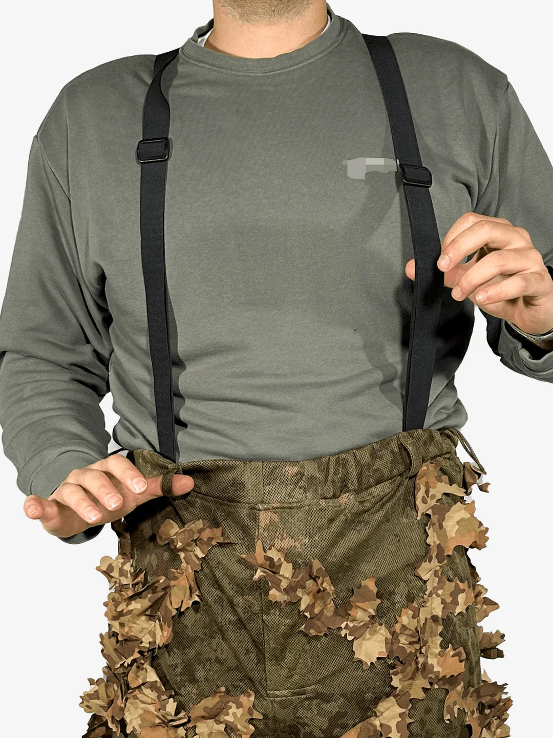 KMCS Ghillie Pants, featuring camouflage material with foliage-style elements designed for outdoor concealment