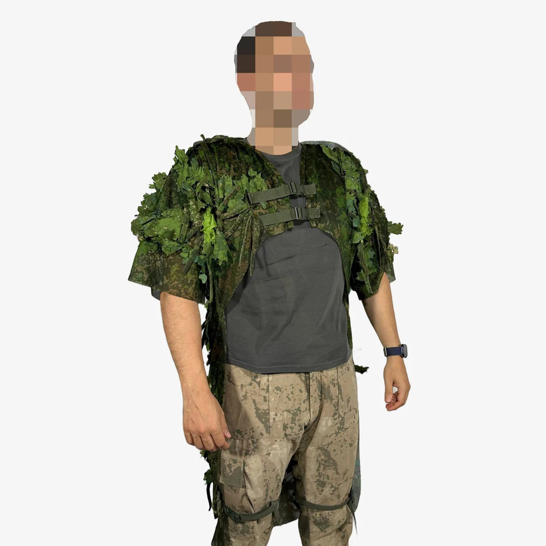 KMCS Python Cloak, featuring a camouflage design with leaf-style elements for outdoor concealment."