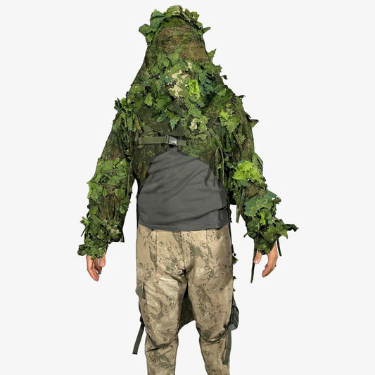 KMCS Python Cloak, featuring a camouflage design with leaf-style elements for outdoor concealment."