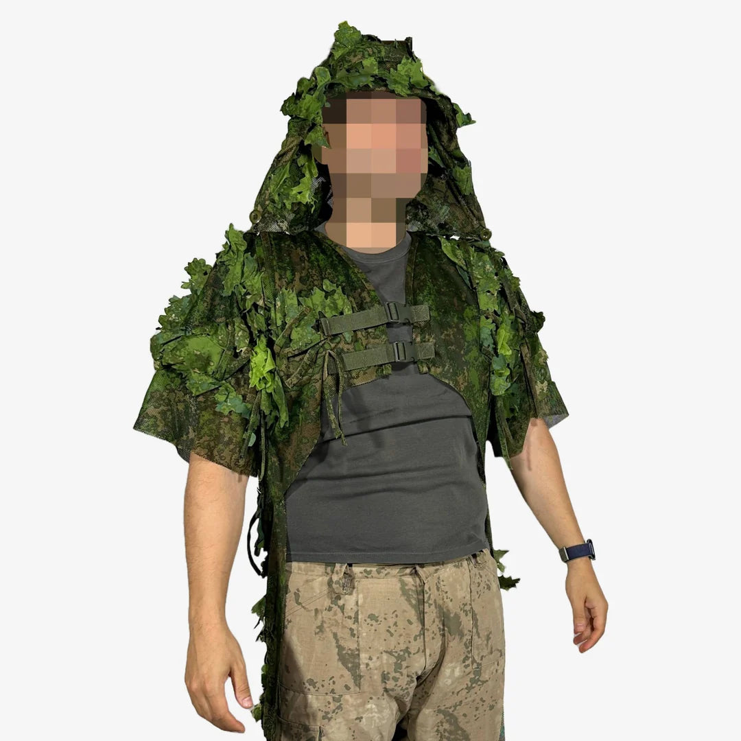 KMCS Python Cloak, featuring a camouflage design with leaf-style elements for outdoor concealment."
